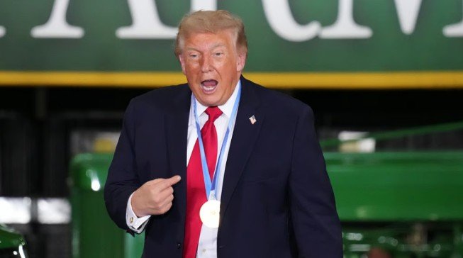 President Donald Trump Wears A Gold Medal From Olympic Speedskater Jordan Stolz At Custer Farms In Chippewa Falls, Wis